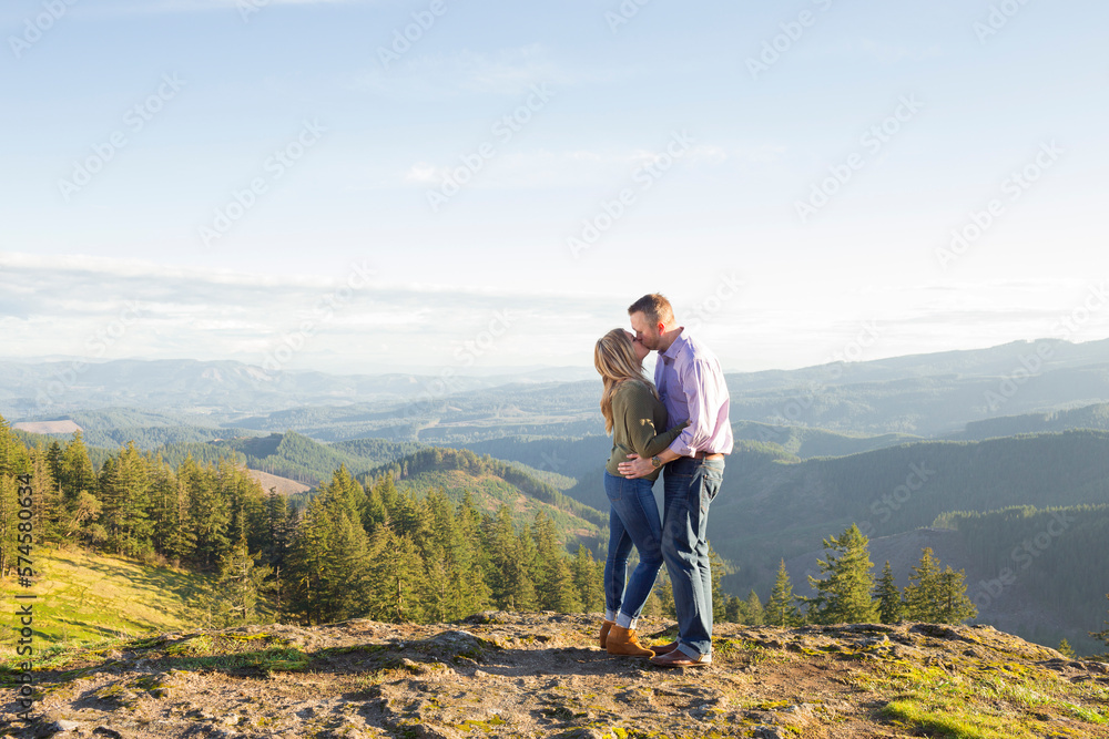 Couple kissing in natural scenery in mountains, Marcola, Oregon, USA Couple kissing in natural scenery in mountains, Marcola, Oregon, USA