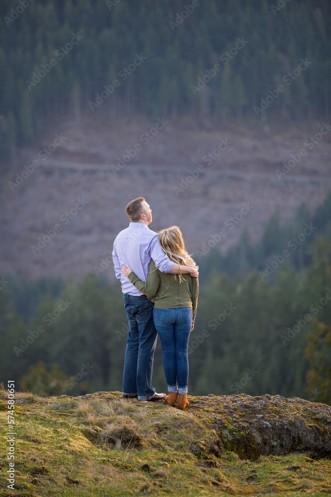 Couple embracing in natural scenery at Horse Rock Ridge trail, Marcola, Oregon, USA Couple embracing in natural scenery at Horse Rock Ridge trail, Marcola, Oregon, USA