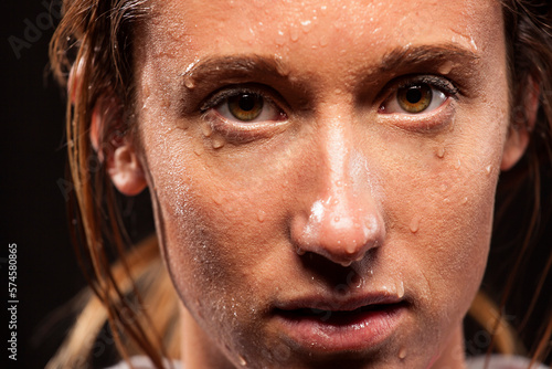 Woman with sweat on face photo
