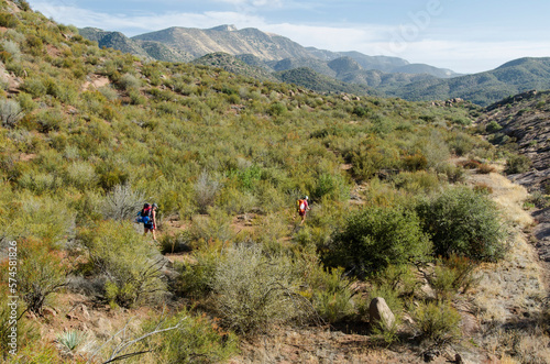 Two young women backpack in the Los Padres National Forest outside of Filmore, California. photo