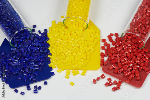 Colored plastic resins in test tubes in laboratory with color samples photo