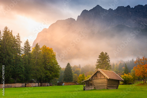 Obraz na płótnie Bavarian alps and rustic farm barn, Garmisch, Zugspitze massif, Bavaria, Germany w salonie