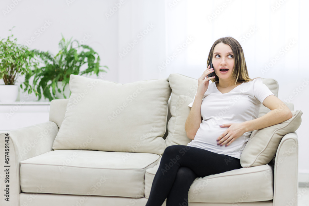 Photo of pregnant woman talking over the phone. Photo of pregnant woman talking over the phone.
