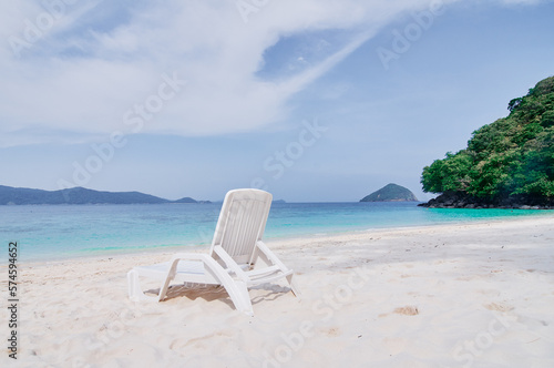 Vacation concept. Traveling by Thailand. Tropical Sea Beach with sunloungers.