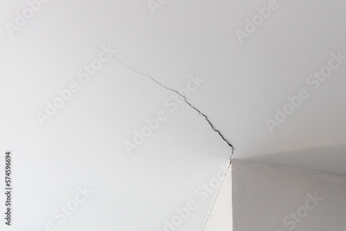 Wallpaper Mural Ceiling room crack in house or office building. Home ceiling broken from structure interior foundation problem concept. Torontodigital.ca