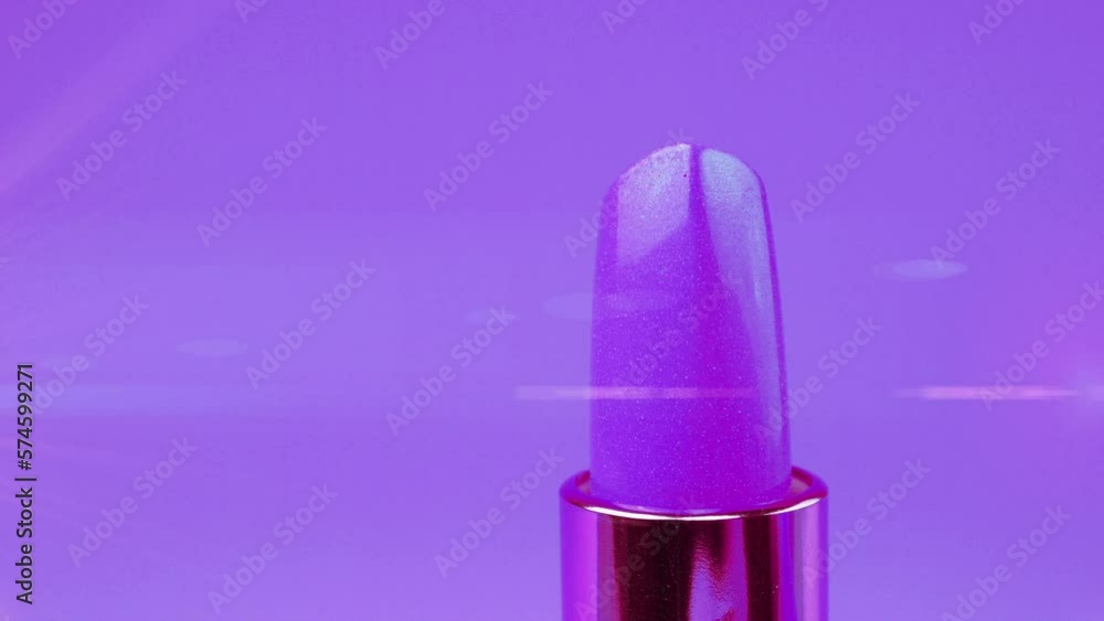 Lipstick on a violet background. Lipstick on a violet background.