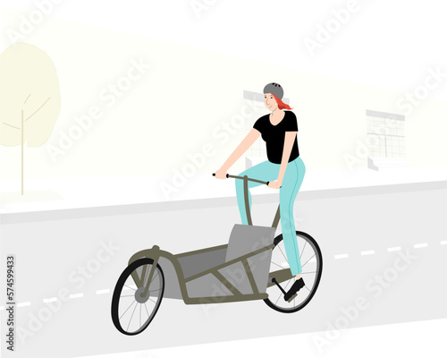 Sportive woman riding empty cargo bicycle on city road. Bakfiets composition.