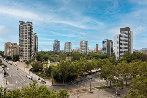 Aerial view of modern high-tech area of Barcelona - Diagonal Mar with high standard of living on the blue sky background. Concept of comfortable life in Spain near the sea