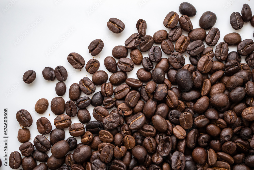 Fresh roasted brown coffee beans on white background Fresh roasted brown coffee beans on white background