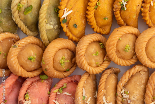 Various Indian Sweet Dumpling Mithai - Rose Gujiya, Karanji, Chandrakala, Suryakala, Kesar Gujia, Thandai Pedakiya Also Called Pirukiya, Pirukia, Basundi, Gughra For Deepawali, Teez Holi, Diwali, Teej