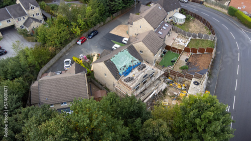 Aerial photo of a typical housing estate in Birkby close to the town centre in Huddersfield, in the Kirklees borough of West Yorkshire showing construction work being done on one the houses