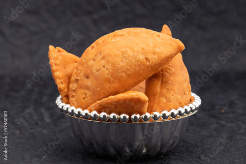 Indian Snacks Salted Dumpling, Namkeen Gujiya Or Deep Fried Farsan Gujia Stuffed With Spiced Mixture, Bhujiya, Spicy Sev, Crispy Namkin Is Enjoyed On Festivals Like Holi, Diwali and Navaratri photo