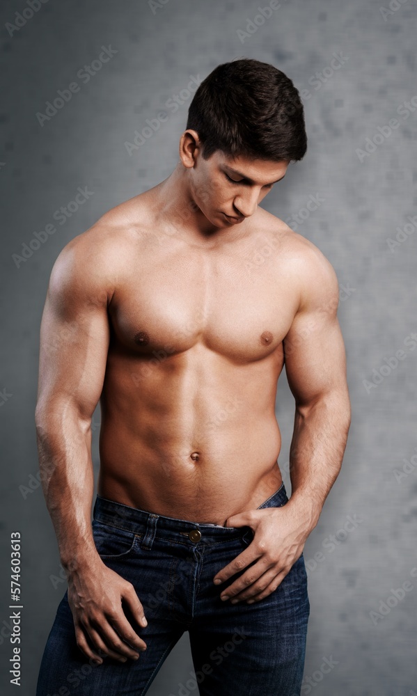 Obraz premium Muscular young handsome man posing