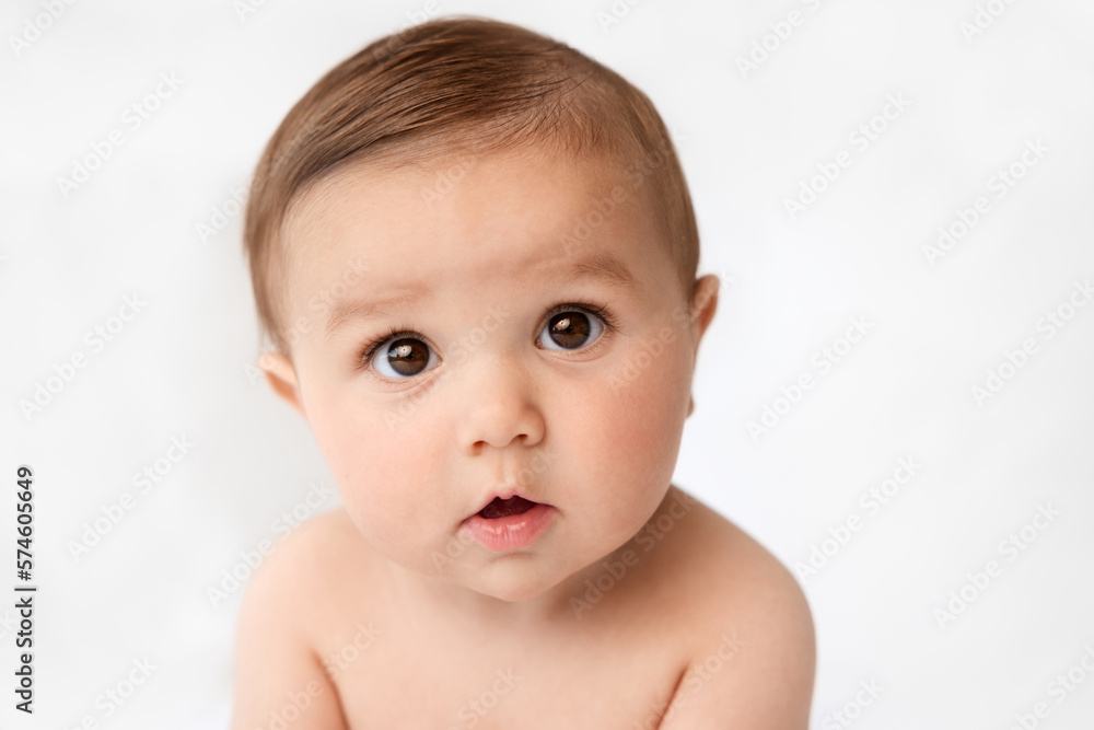 Close-up portrait of funny baby with puzzled expression Close-up portrait of funny baby with puzzled expression