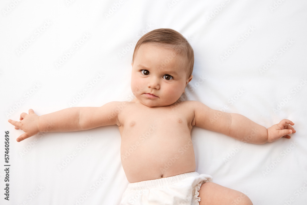 Portrait of young baby with serious expression Portrait of young baby with serious expression
