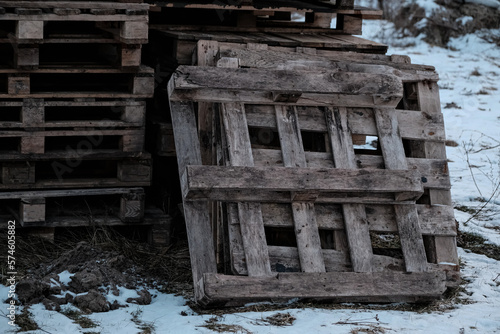 Stacks of wooden pallets on site of construction project