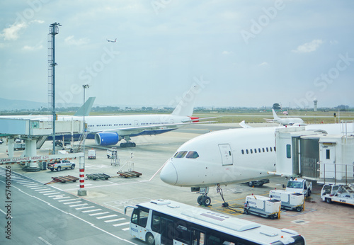 Airplane, bus or loading luggage on runway for traveling outdoors at worldwide airport for journey. Global, transportation services or commercial aeroplane on ground for international flight cargo