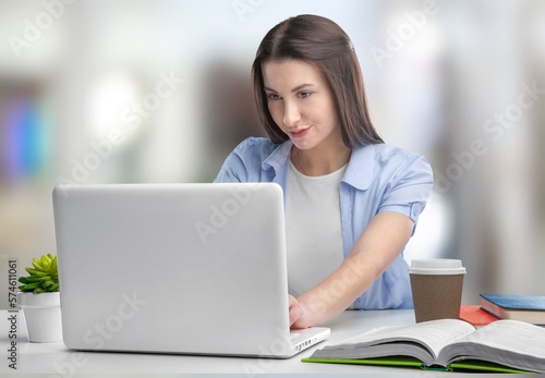 Serious young businesswoman sitting at work in office Free Download Serious young businesswoman sitting at work in office - GFXLoad