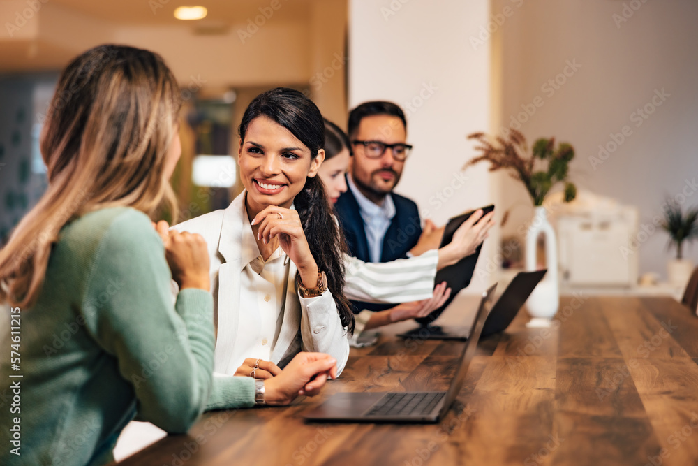 Group of business people working over the laptop and tablet, sitting at the office. Group of business people working over the laptop and tablet, sitting at the office.