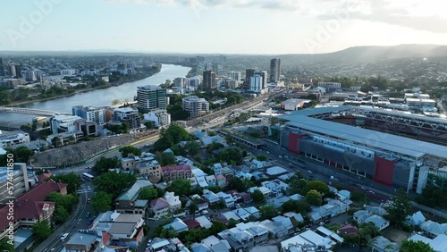 Aerial drone shot flying around Petrie Terrace Suburb, with breathtaking views of Suncorp Stadium, Brisbane River, Brisbane City, and Roma St Station. Shot on a sunny afternoon. Rotational Drone shot photo