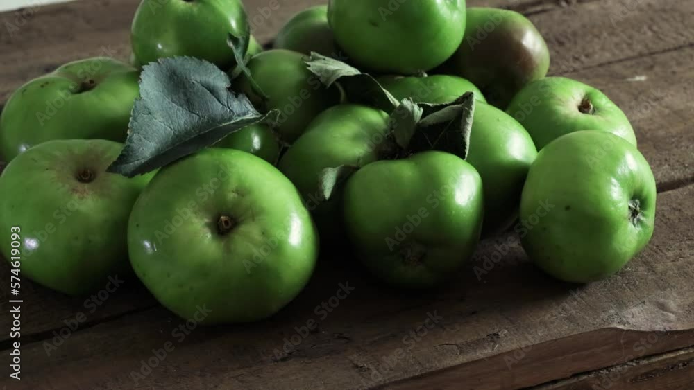 freshly picked green apples on a wooden table freshly picked green apples on a wooden table