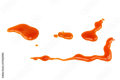 Orange sauce splashes isolated on white background. Top view.