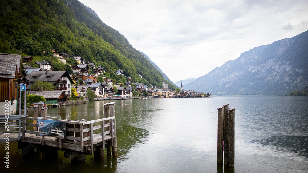 Naklejka premium Mountain village with a lake in the Alps in Europe with historic houses