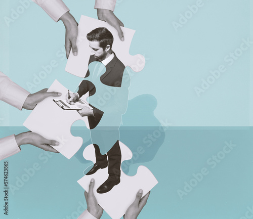 Obraz na płótnie Hands joining puzzle pieces and forming a business executive