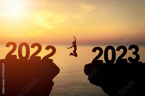 Person jumping with 2023 numbers. New Year concept.