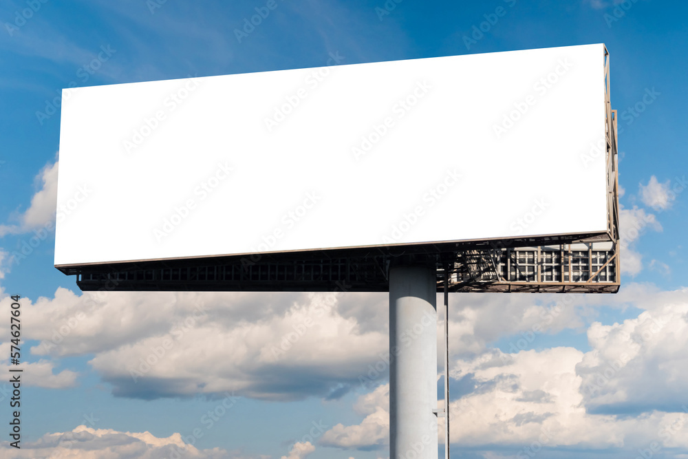 Mock up - blank wide white billboard or large advertising display against blue sky with white clouds. Consumerism, white screen, template, mock up and copy space concept Mock up - blank wide white billboard or large advertising display against blue sky with white clouds. Consumerism, white screen, template, mock up and copy space concept