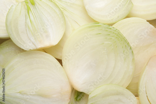 Pieces of fresh ripe onion as background