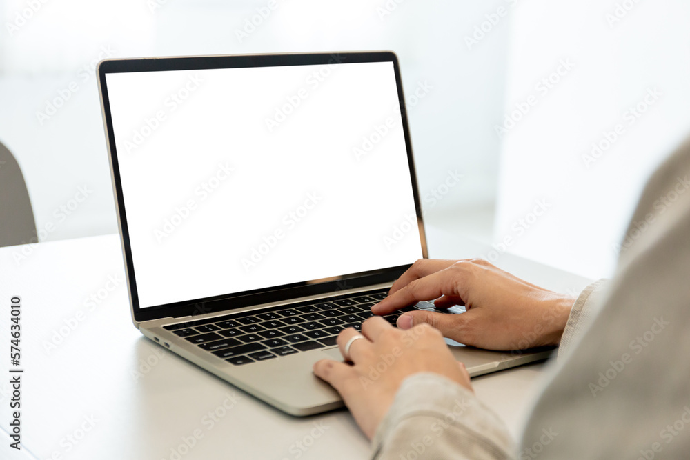 computer screen blank mockup.hand woman work using laptop with white background for advertising,contact business search information on desk at coffee shop.marketing and creative design computer screen blank mockup.hand woman work using laptop with white background for advertising,contact business search information on desk at coffee shop.marketing and creative design