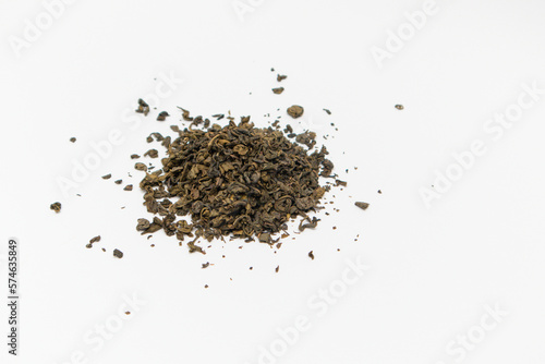 Close-up of dry green tea on white background. Top view. Close up.