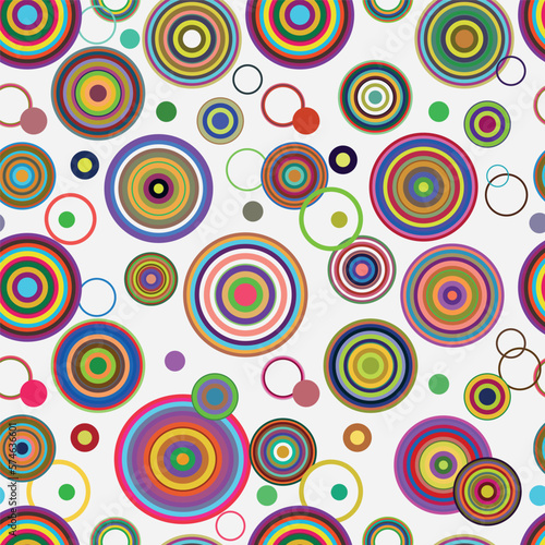Vector seamless pattern with colorful circles and rings on a white background in retro style