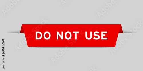 Red color inserted label with word do not use on gray background