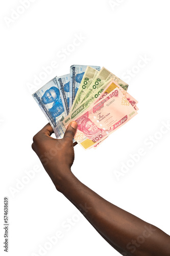 hand with money with arranged naira notes in order of it value. The new Nigerian currency is isolated on white background