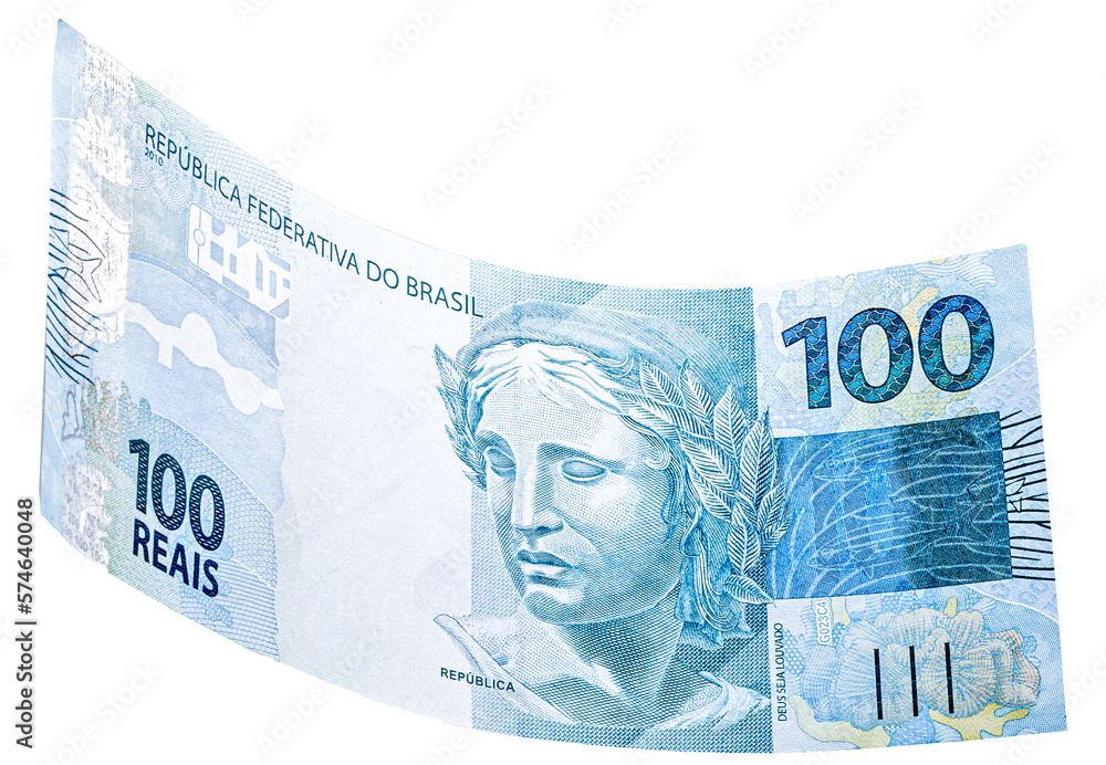 banknote of one hundred reais from brazil falling on isolated white background - obrazy, fototapety, plakaty 