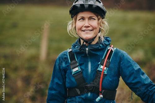 Young woman making a funny face before going mountain biking photo