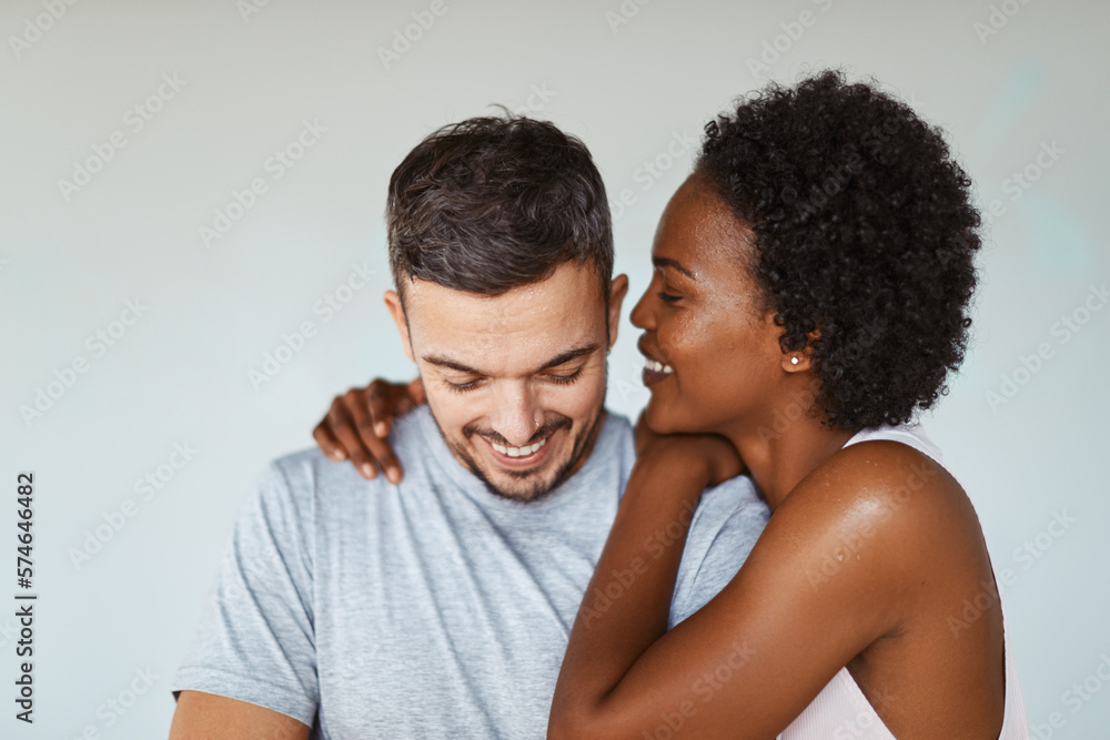 Laughing young couple standing together at the gym Laughing young couple standing together at the gym