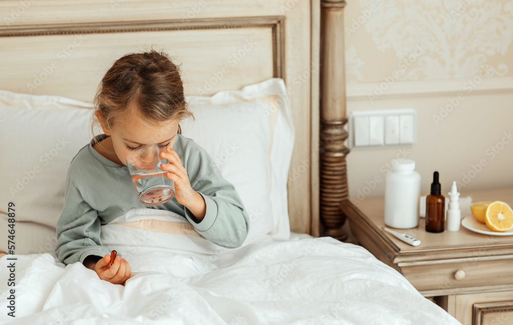 child sick girl drink fresh water take medicine and fever heat lying on bed at home glass of water kid ill child sick girl drink fresh water take medicine and fever heat lying on bed at home glass of water kid ill