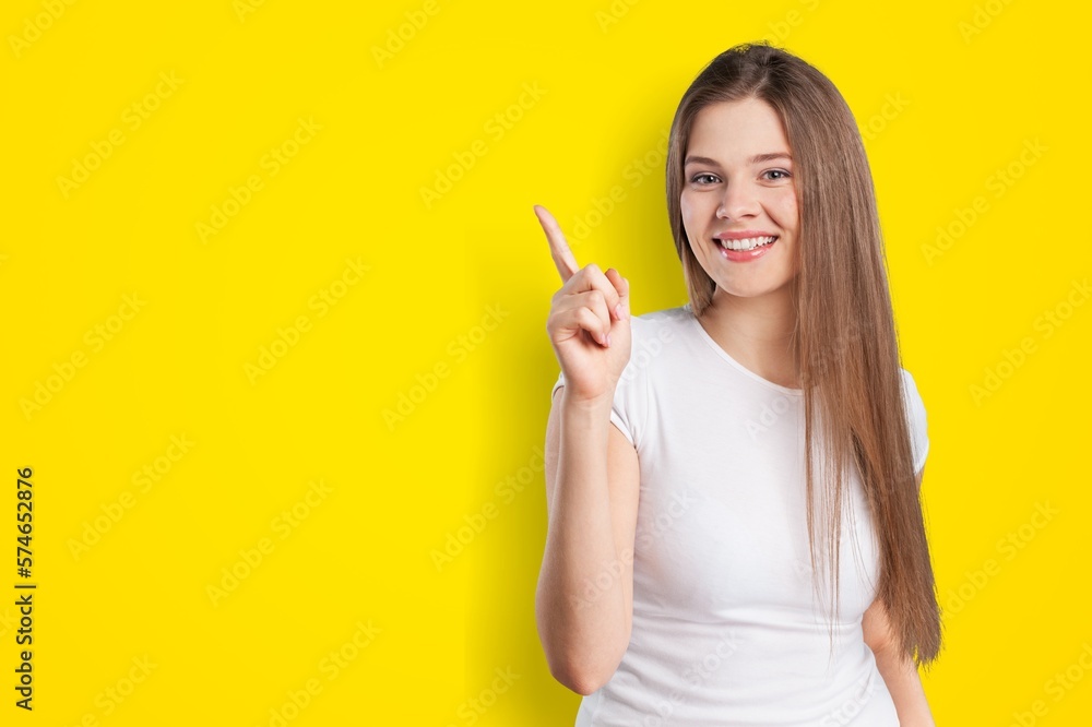 Happy young smile woman posing on color background Happy young smile woman posing on color background