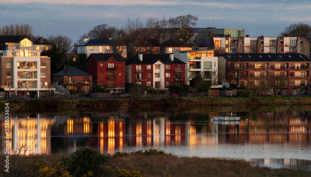 Houses on a street in Galway, Ireland are reflected on the surface Houses on a street in Galway, Ireland are reflected on the surface