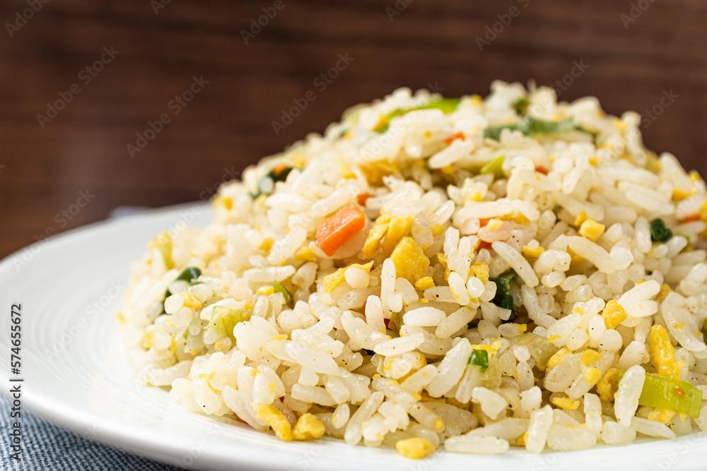 Egg fried rice made by stir-frying eggs, rice and vegetables Stock