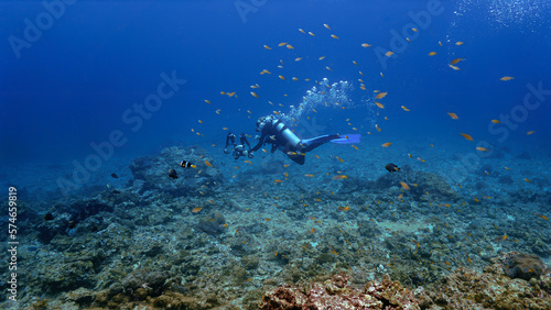 Underwater photographer at a coral reef. From a scuba in Thailand.
