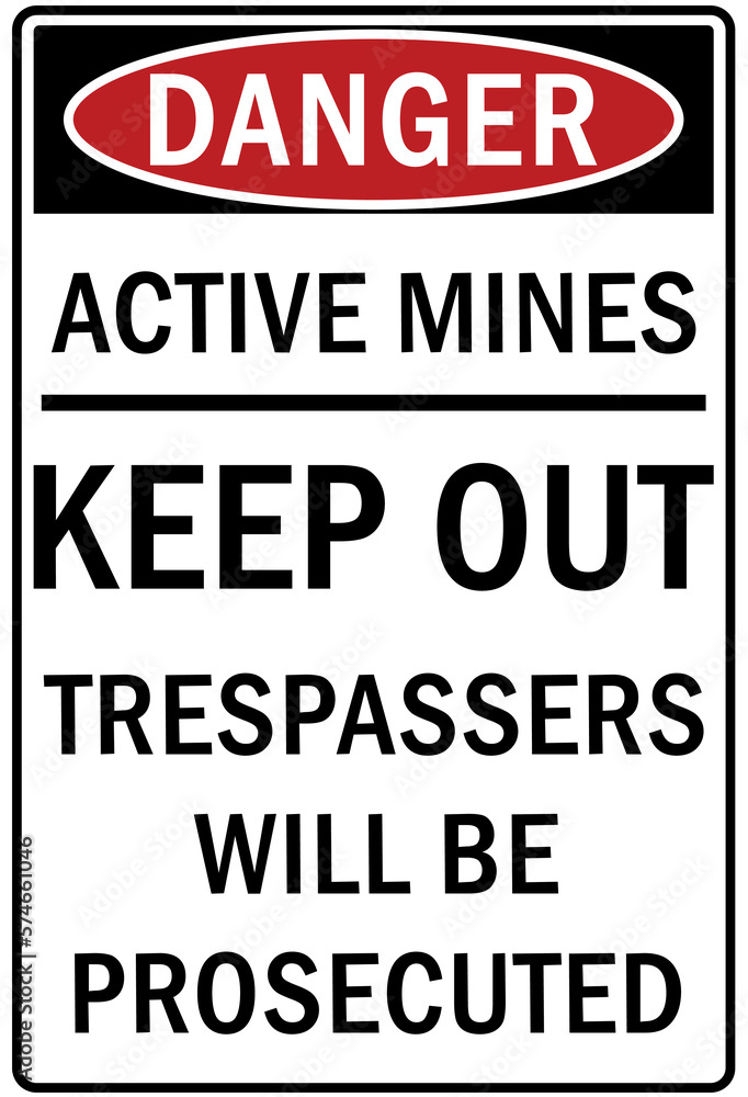 Active mining area danger sign and labels keep out, trespasser will be prosecuted