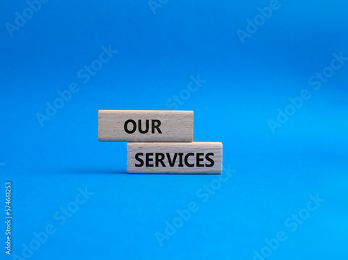 Our services symbol. Concept words Our services on wooden blocks. Beautiful blue background. Business and Our services concept. Copy space.