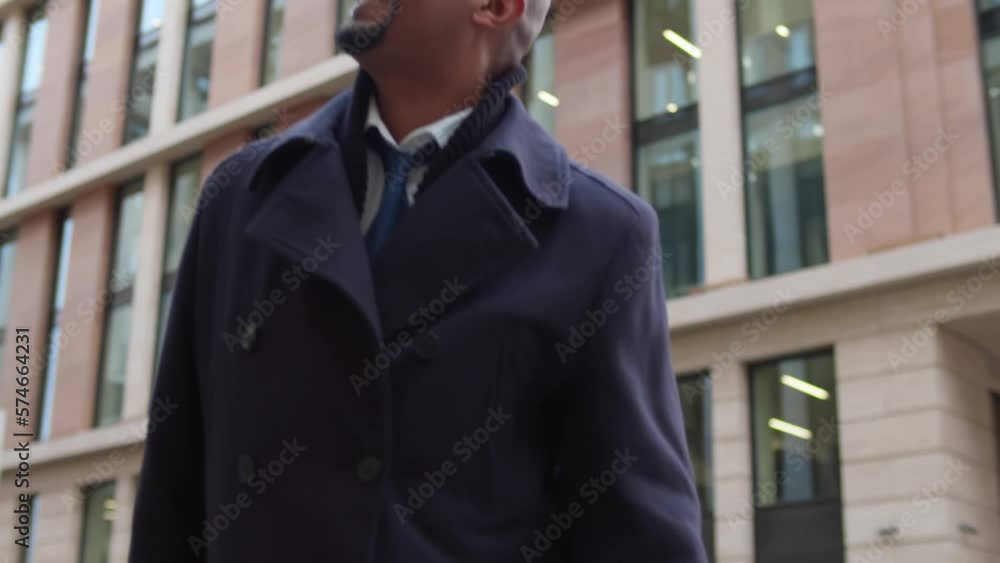 Happy satisfied excited businessman in suit rises hands up near modern office building. Realtime Happy satisfied excited businessman in suit rises hands up near modern office building. Realtime