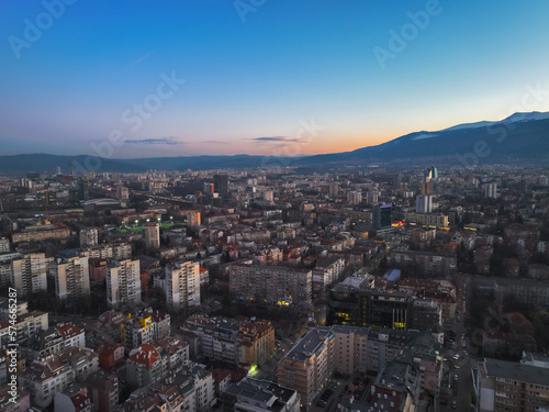 Eastern area of Sofia city and Vitosha mountain at dusk photo