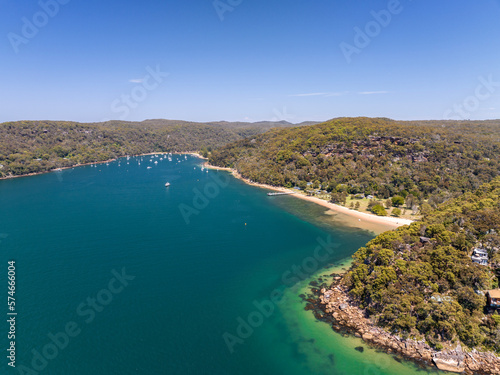 Aerial drone view of Currawong Beach and The Basin on the western shores of Pittwater in Ku-ring-gai Chase National Park, Sydney, NSW, Australia. Currawong can be reached via ferry from Palm Beach.