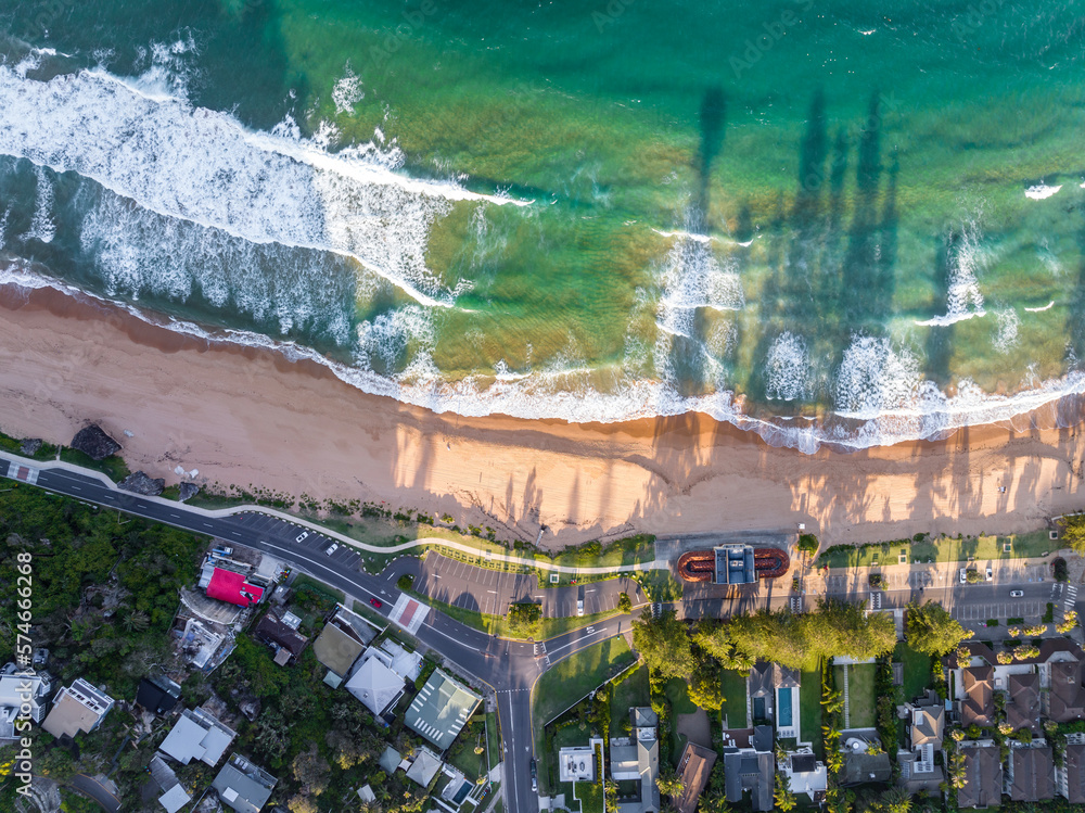 High angle aerial evening bird's eye view of Palm Beach coastline and promenade. Palm Beach is an affluent beachside suburb in the Northern Beaches region of Sydney, New South Wales, Australia.